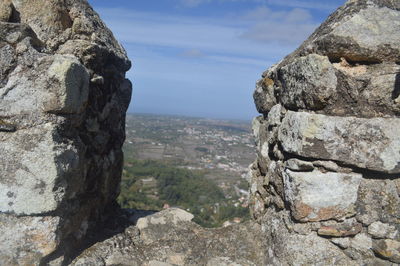 Rocks on mountain against sky