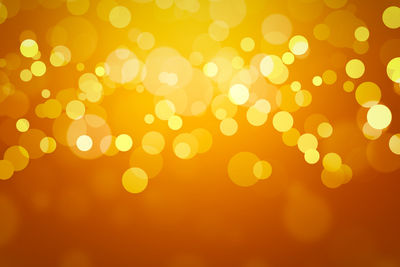 Defocused image of illuminated yellow lights