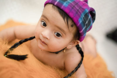 Close-up of cute baby looking away