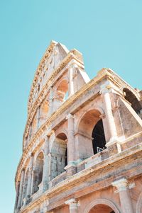 Low angle view of historical building against clear blue sky