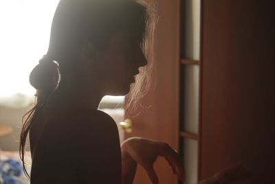 Close-up portrait of woman looking at camera