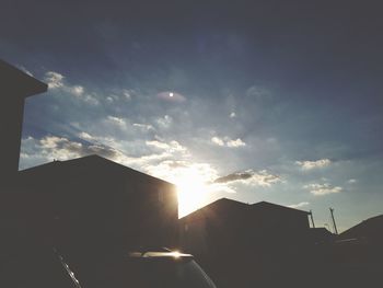 Low angle view of silhouette buildings against sky during sunset