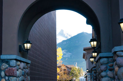 Buildings seen through arch window
