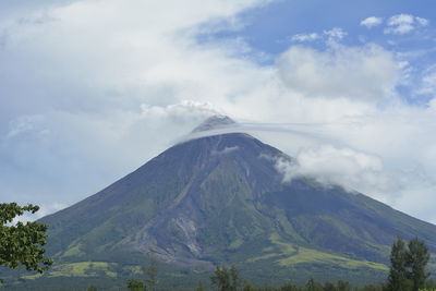 Scenic view of volcanic mountain against sky