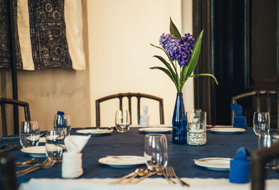 Flower vase on table at restaurant