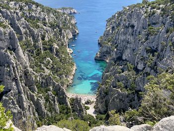 High angle view of rocks by sea