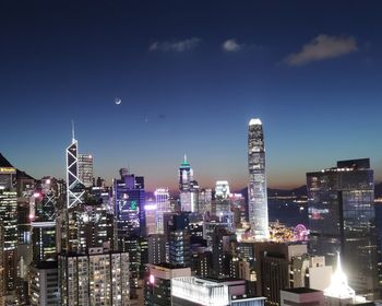 Illuminated buildings in city at night