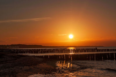 Scenic view of calm sea at sunset