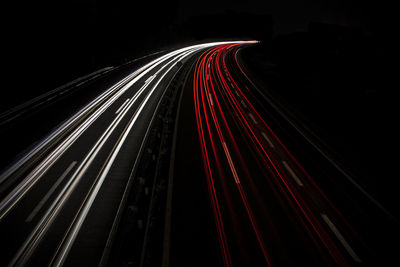 Light trails on road in city at night