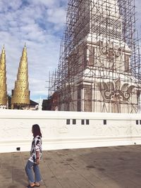 Full length of woman standing at temple