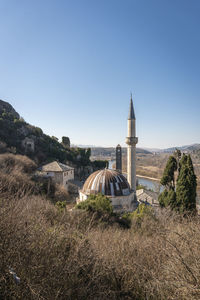 Aerial view of mosque and minaret in pocitelj in the capljina municipality in bosnia and herzegovina