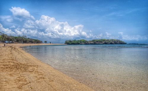 Scenic view of beach against sky