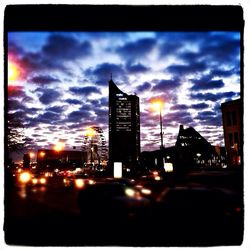 Skyscrapers in city at dusk