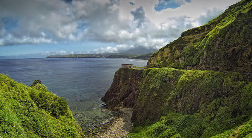 Scenic view of sea against cloudy sky