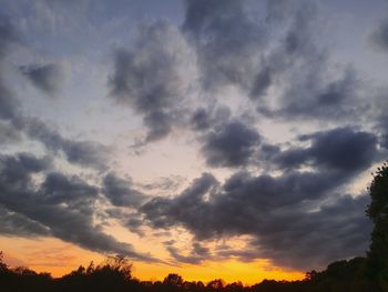 Low angle view of dramatic sky during sunset