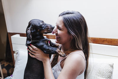 Woman with dog at home