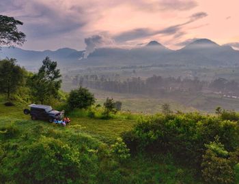 Scenic view of landscape and mountains against sky