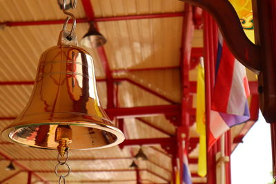 Low angle view of pendant lights hanging from ceiling