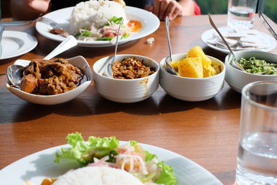 High angle view of various food in bowls 