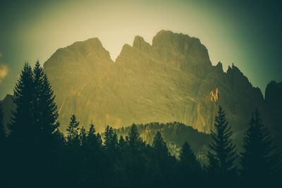 Scenic view of silhouette mountains against sky at sunset