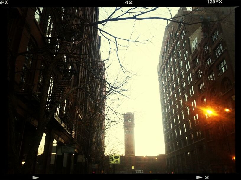 architecture, built structure, building exterior, low angle view, city, transfer print, auto post production filter, connection, sky, bridge - man made structure, clear sky, building, tower, skyscraper, outdoors, transportation, no people, dusk, metal, city life