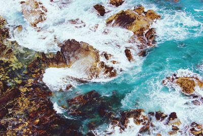 High angle view of rocks in sea