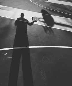Shadow of people on road
