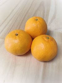 Close-up of oranges on table