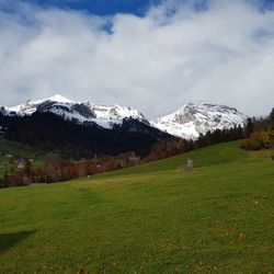 Scenic view of snowcapped mountains against sky