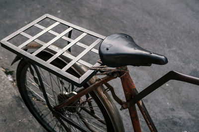 High angle view of bicycle parked on footpath