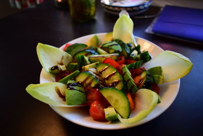 High angle view of chopped vegetables in bowl on table