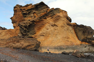 Woman posing at majestic rock formations