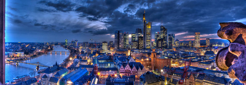 Cityscape against cloudy sky