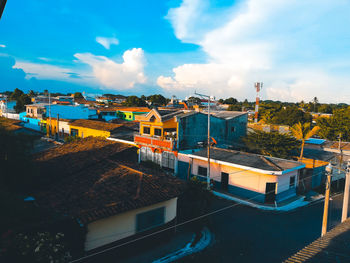 High angle view of buildings in city against sky