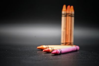 Close-up of colored pencils on table