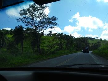 Road seen through car windshield