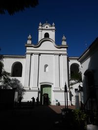 Low angle view of building against blue sky