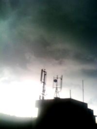 Low angle view of built structure against cloudy sky