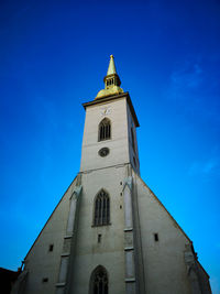 Low angle view of clock tower against sky