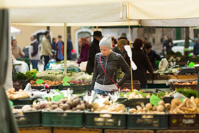 People at market stall