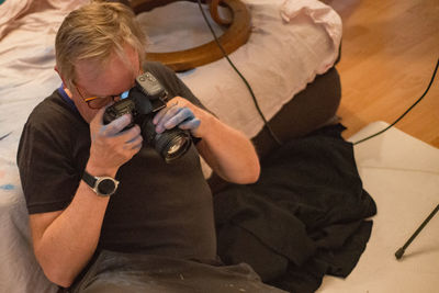 High angle view of man photographing