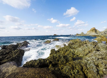 View of calm beach against the sky