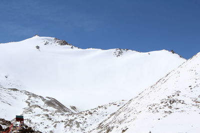 Low angle view of ski lift against sky