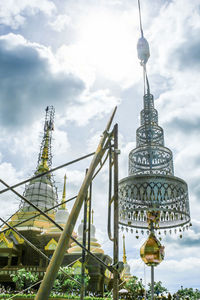 Low angle view of bell tower against cloudy sky