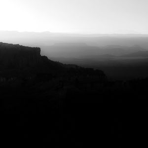 Scenic view of silhouette mountains against sky