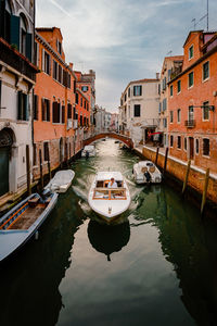 Boats moored in canal