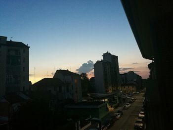 Cityscape against clear sky during sunset