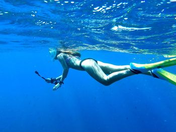 Woman swimming in sea