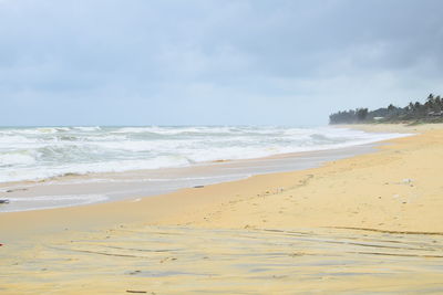 Scenic view of beach against sky