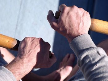 Close-up of man holding hands